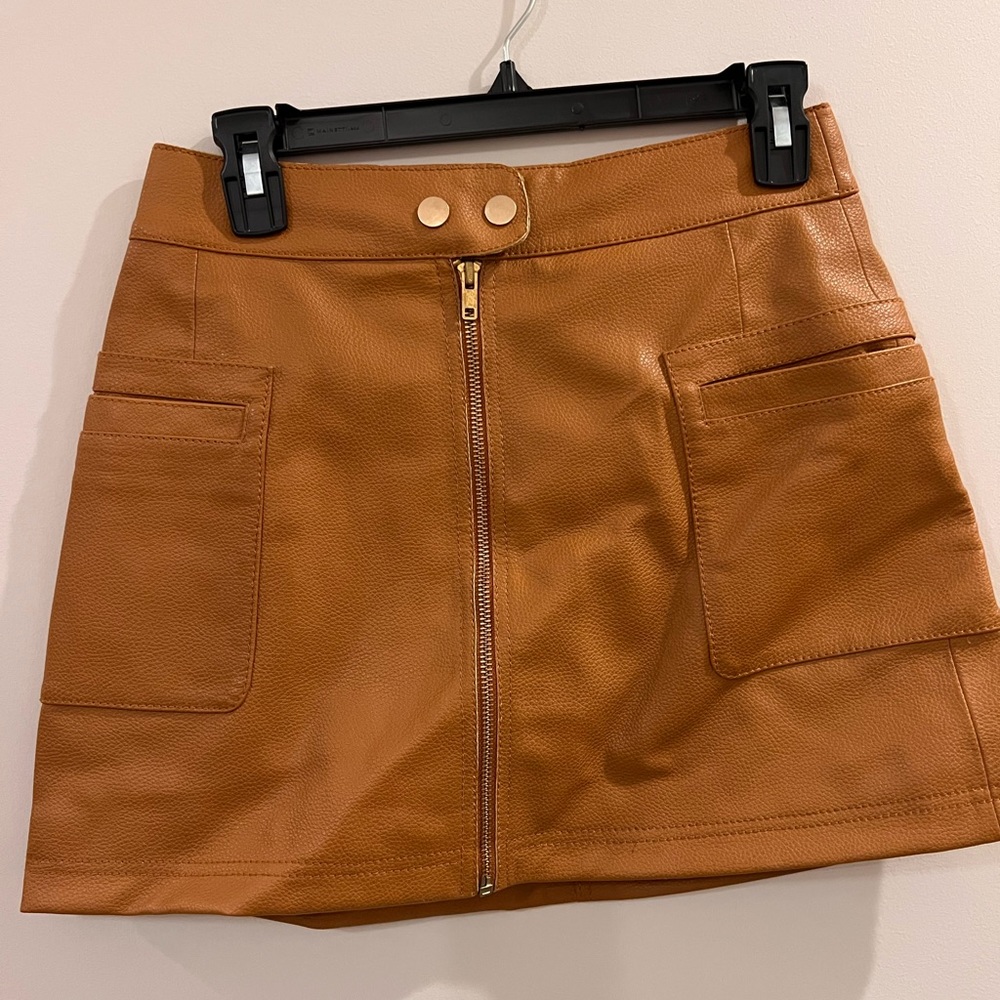 Free People vegan leather mini skirt. Never worn